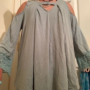 Greenish blouse with lace sleeves